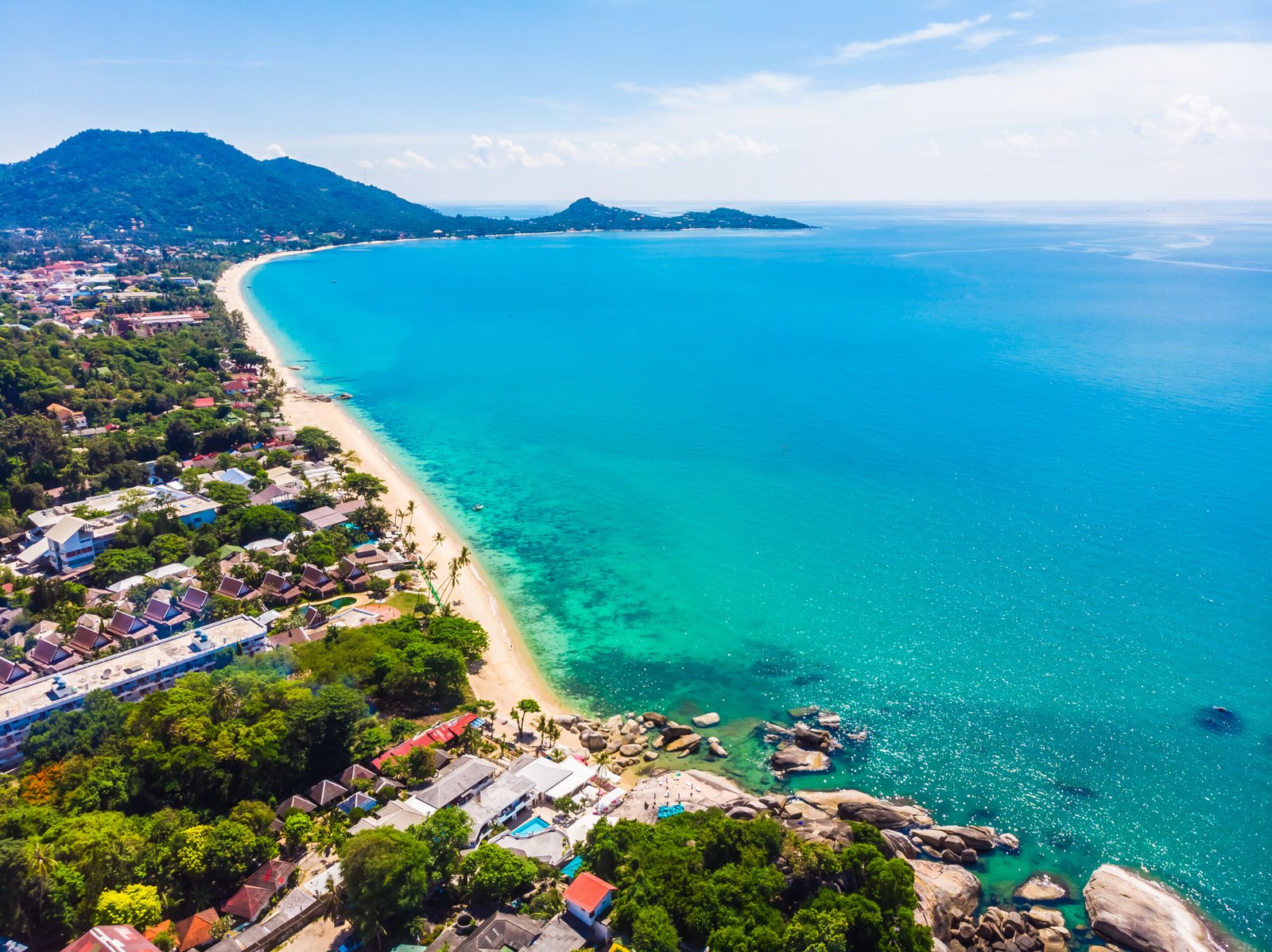 Aerial view of beautiful tropical beach and sea with palm and ot