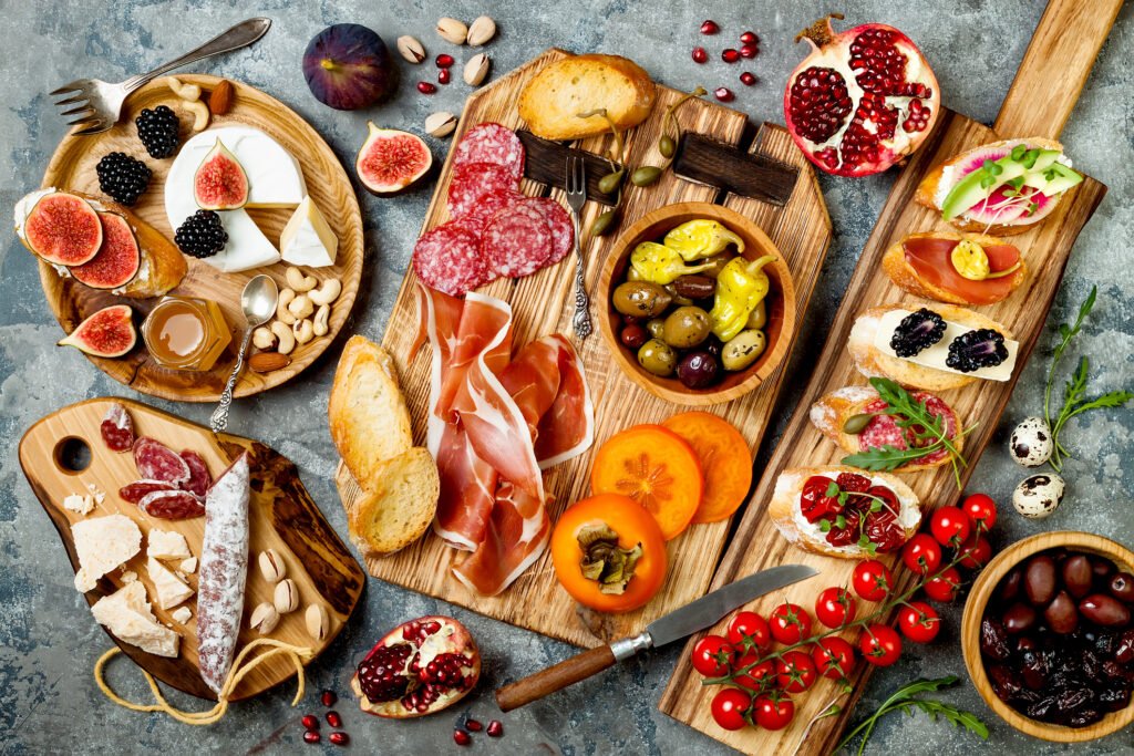 appetizers-table-with-italian-antipasti-snacks-brushetta-or-authentic-traditional-spanish-tapas-set-cheese-variety-board-115788226740