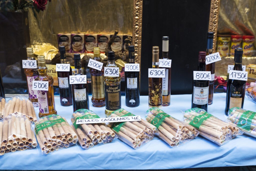 bottles-of-muscatel-and-neules-in-a-pastry-shop-in-catalonia-915198590520