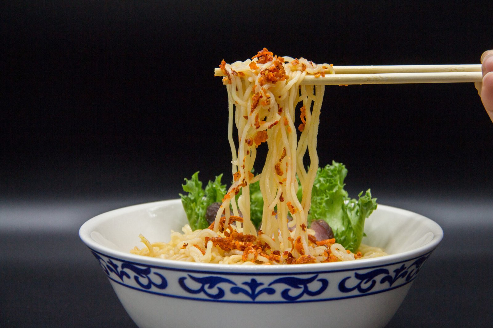 close-up-food-served-table-against-black-background
