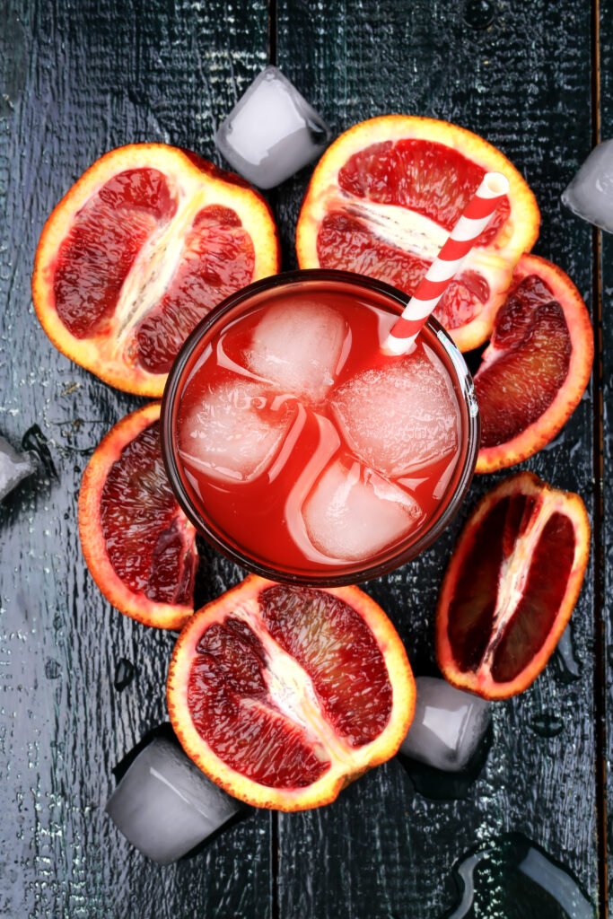 Fresh juice from blood oranges ice wooden retro cool summer drink