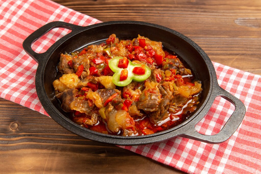front-view-cooked-vegetable-meal-including-vegetables-meat-inside-brown-desk