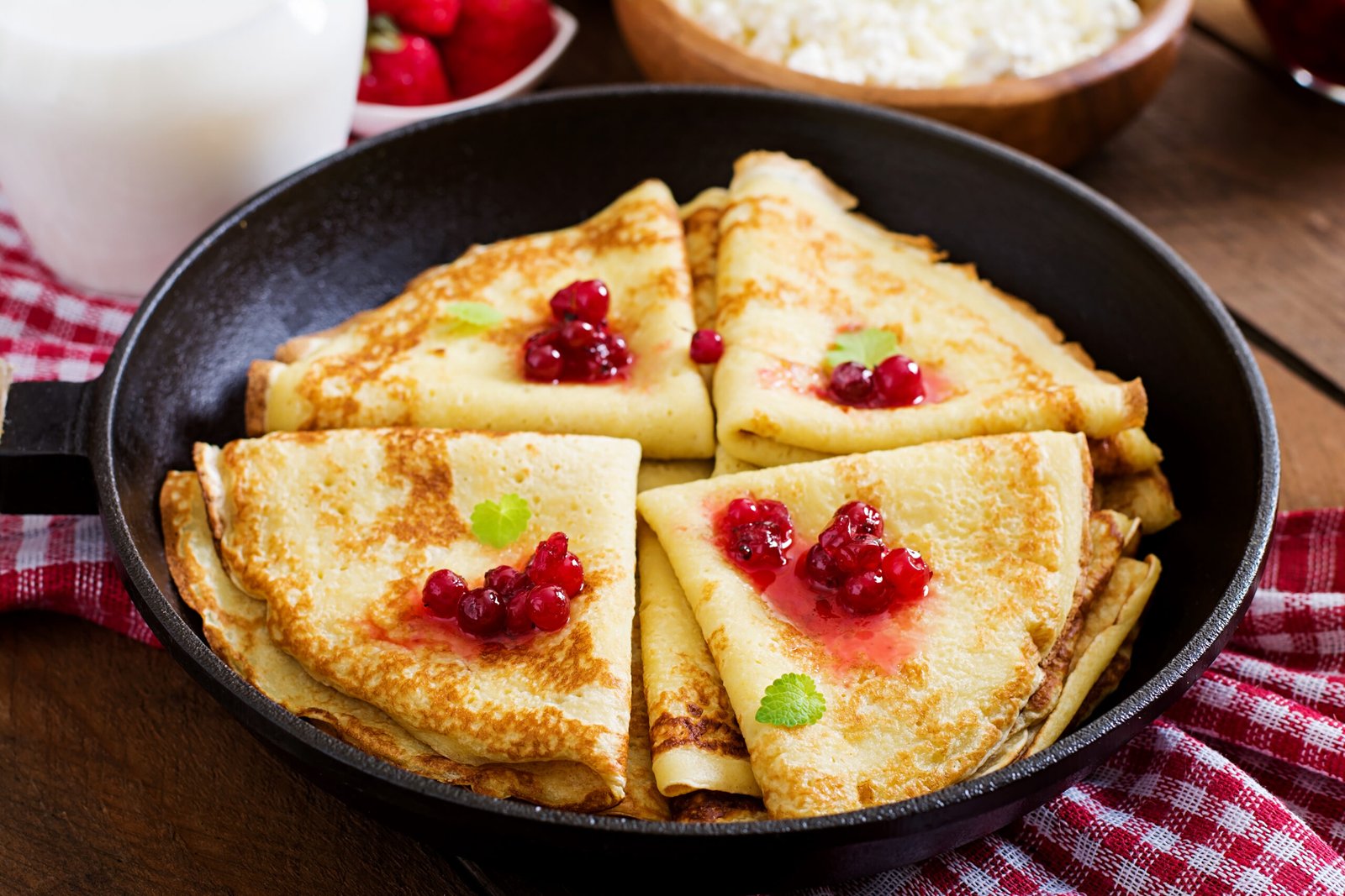 golden-pancakes-with-cranberry-jam-honey-rustic-style-top-view