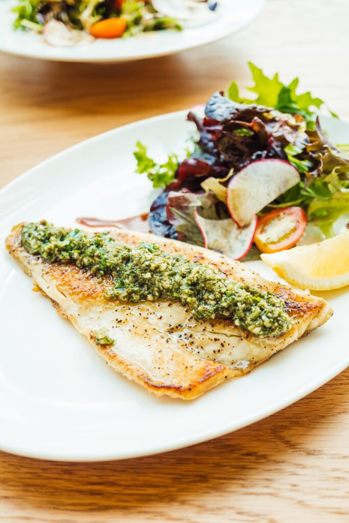 Grilled sea bass fish meat steak with vegetable