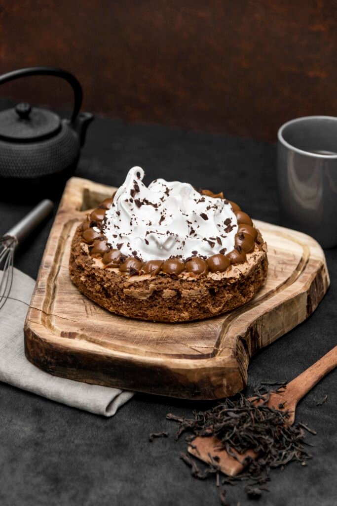 high-angle-cake-with-tea-pot-spatula