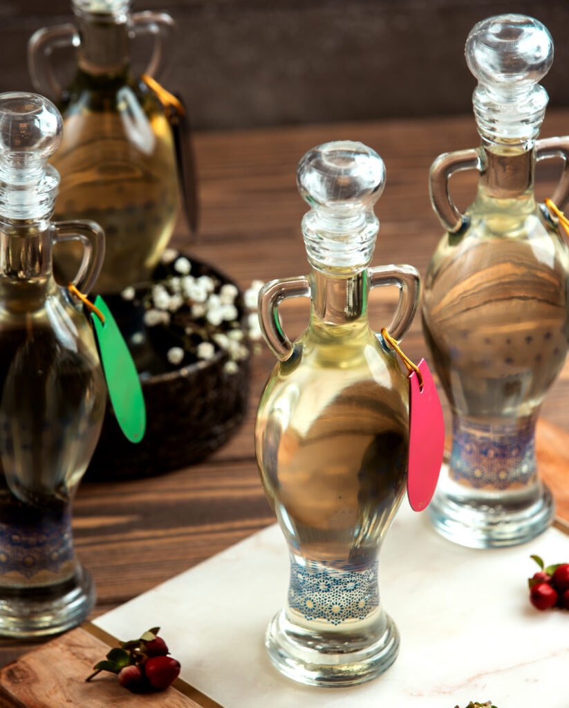 a liquid in ornate bottles