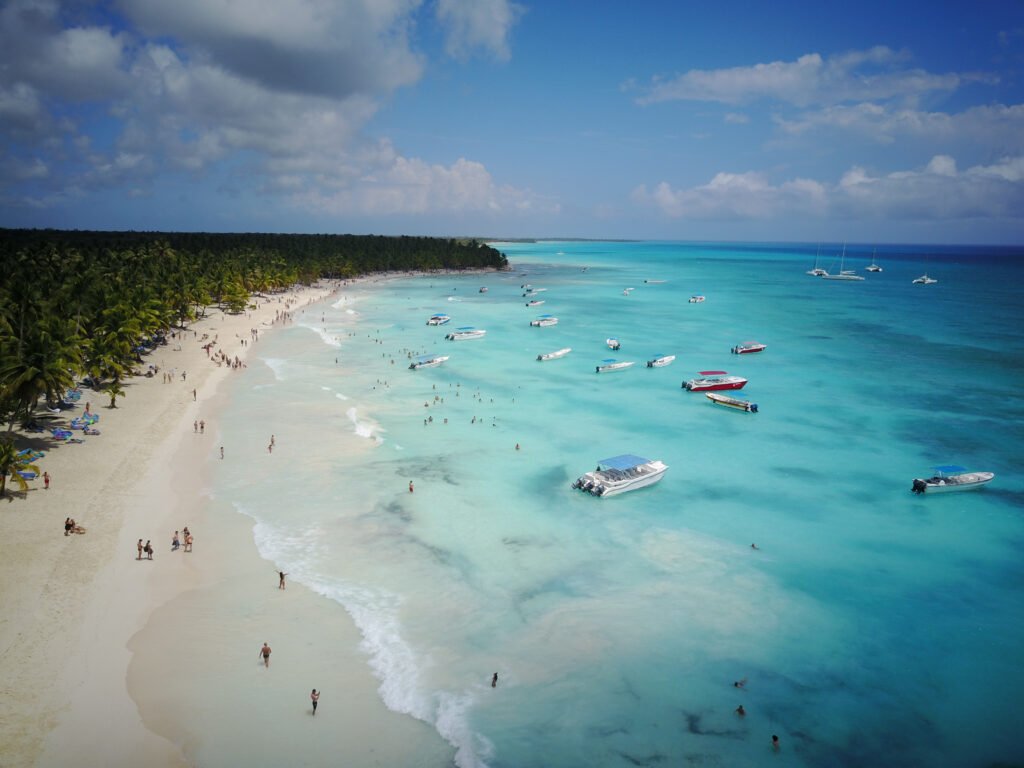 Look from above at turquoise water along golden beach somewhere