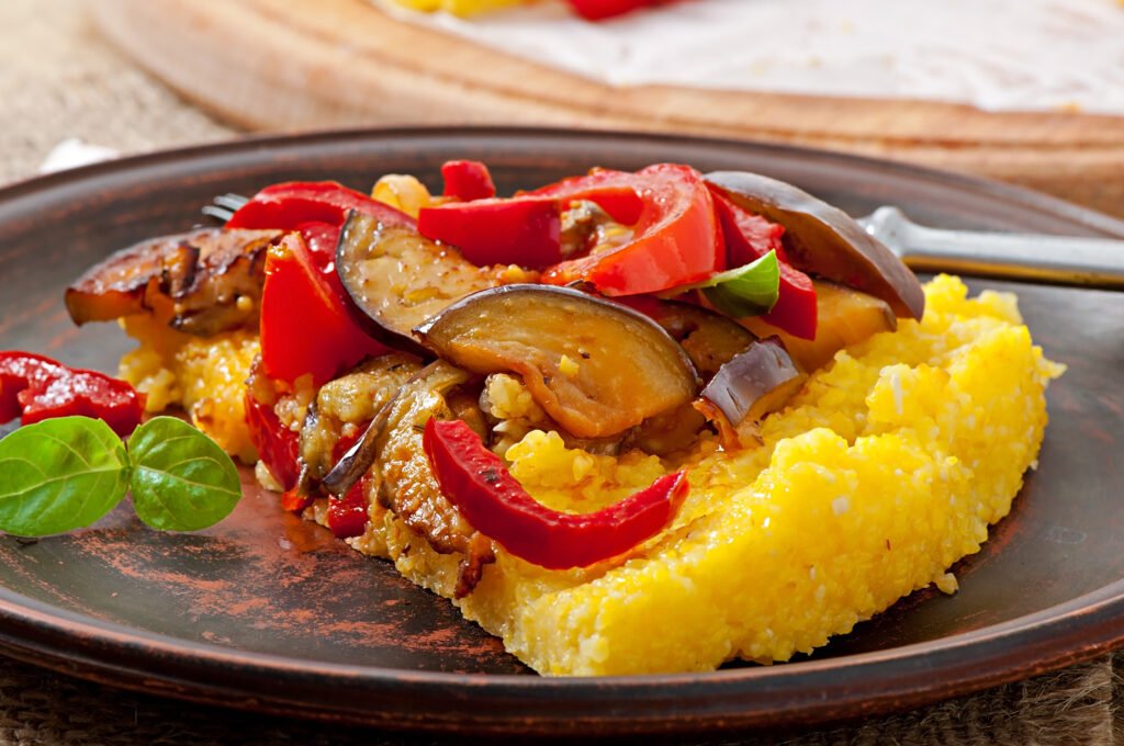 Polenta with vegetables - corn grits pizza with tomato and eggplant