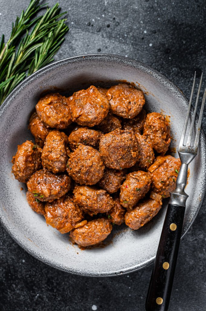 Roasted Meatballs in tomato sauce from ground beef and pork meat