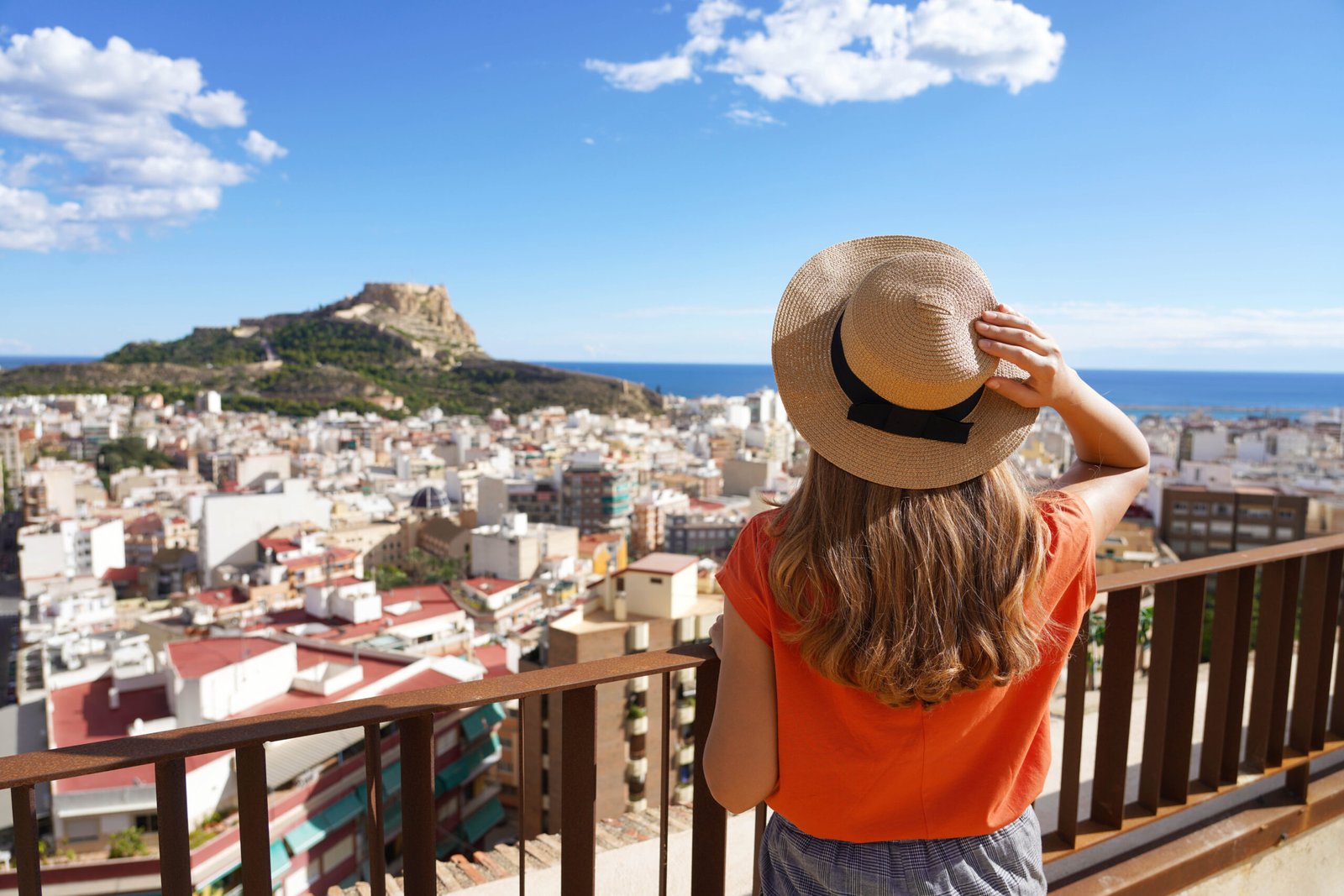 Visiting Alicante in Spain. Traveler girl enjoying view of Alica