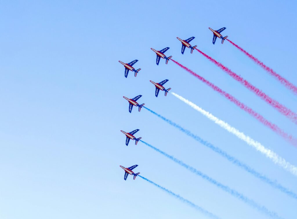Colorful aerial display by the French aerobatic team over Saint-Jean-de-Luz.