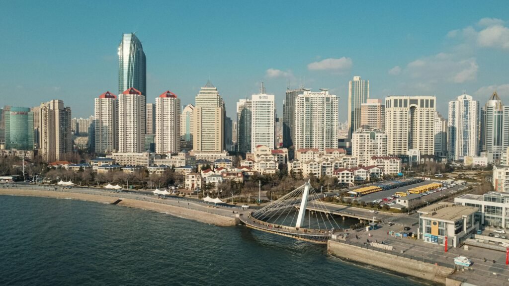 Qingdao seafood specialties displayed at a bustling market A stunning aerial photograph of Qingdao's city skyline and coastline in China.