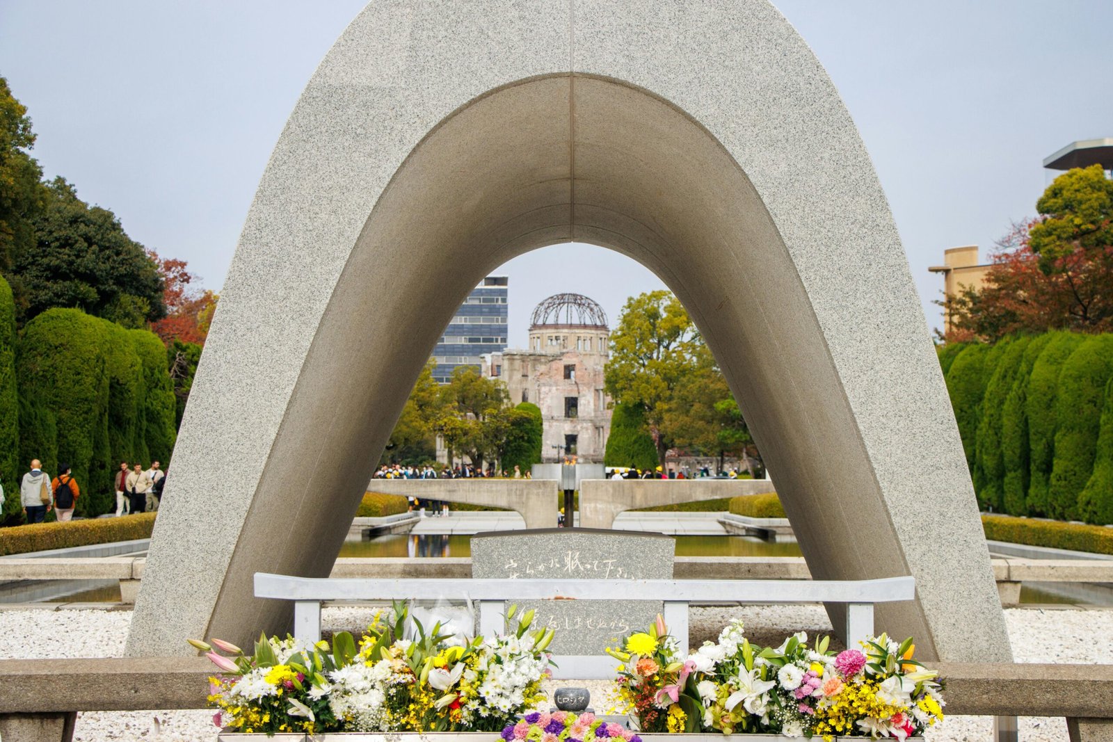 View of Hiroshima Memorial and Atomic Bomb Dome through arch in Peace Park.