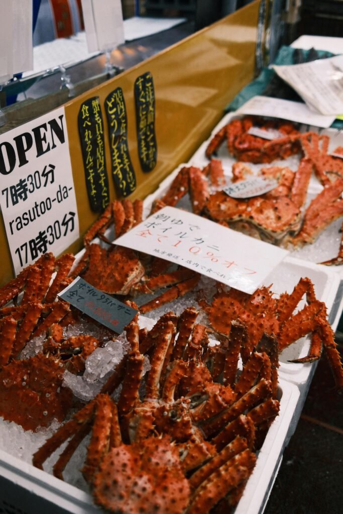 pexels-photo-31416918-31416918 King crab on ice at a Hokkaido market, showcasing fresh seafood in Japan.