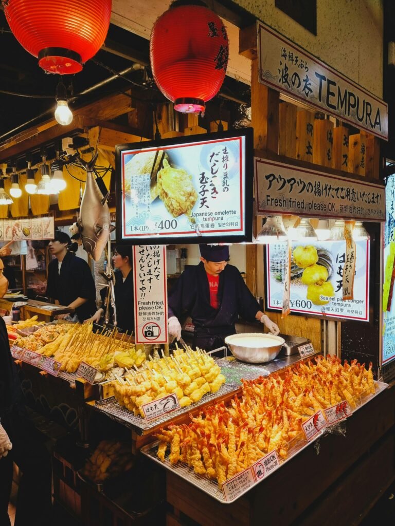 pexels-photo-31569911-31569911 Bustling Japanese street market scene with tempura display. Perfect for food and travel themes.